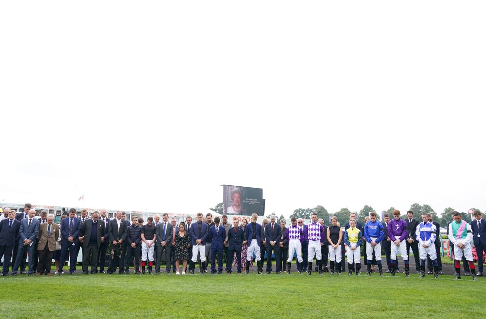 Jockeys hold a 2 minutes silence following the death of Queen Elizabeth II on Thursday of at Doncaster Racecourse. Picture date: Sunday September 11, 2022.