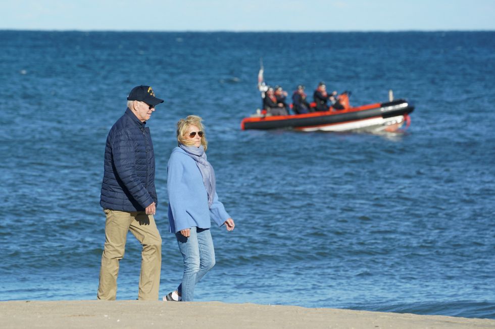 Joe Biden and Jill walk along beach in Delaware