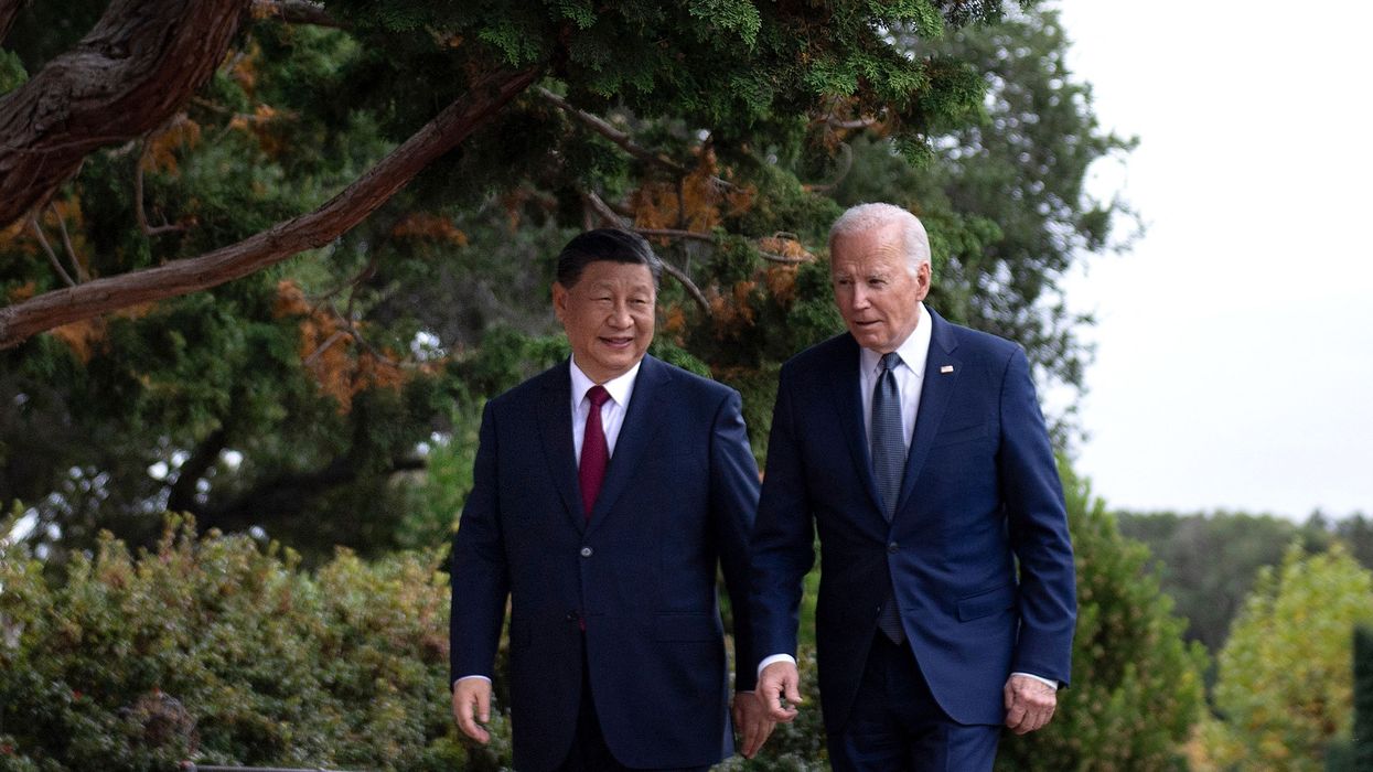 Joe Biden and Xi Jinping walk together after a meeting during the Asia-Pacific Economic Cooperation summit