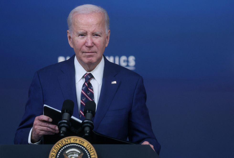 Joe Biden listens to a question from a reporter after speaking at an event about the economy, at the White House in Washington