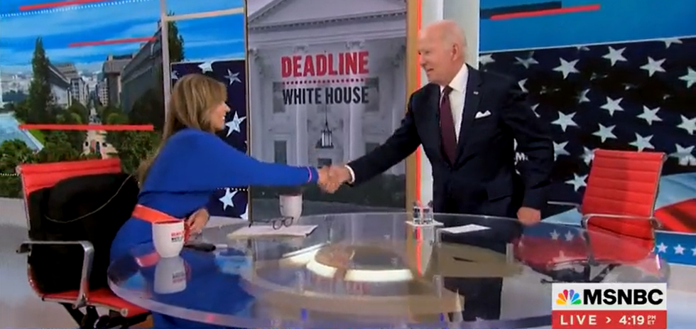 Joe Biden shaking hands with Nicolle Wallace