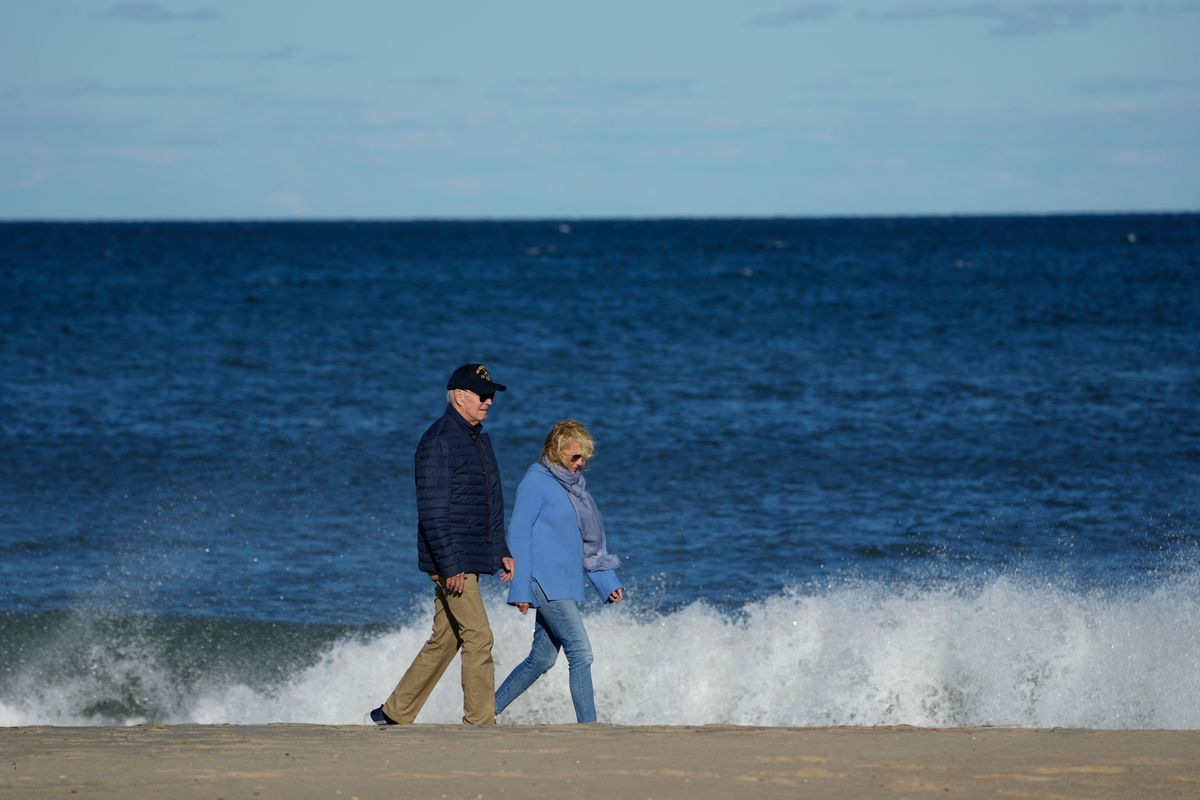 Joe Biden walks on beach with Jill