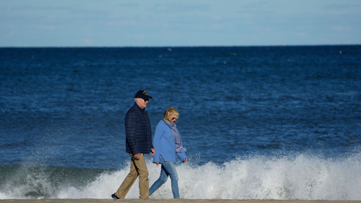 Joe Biden walks on beach with Jill