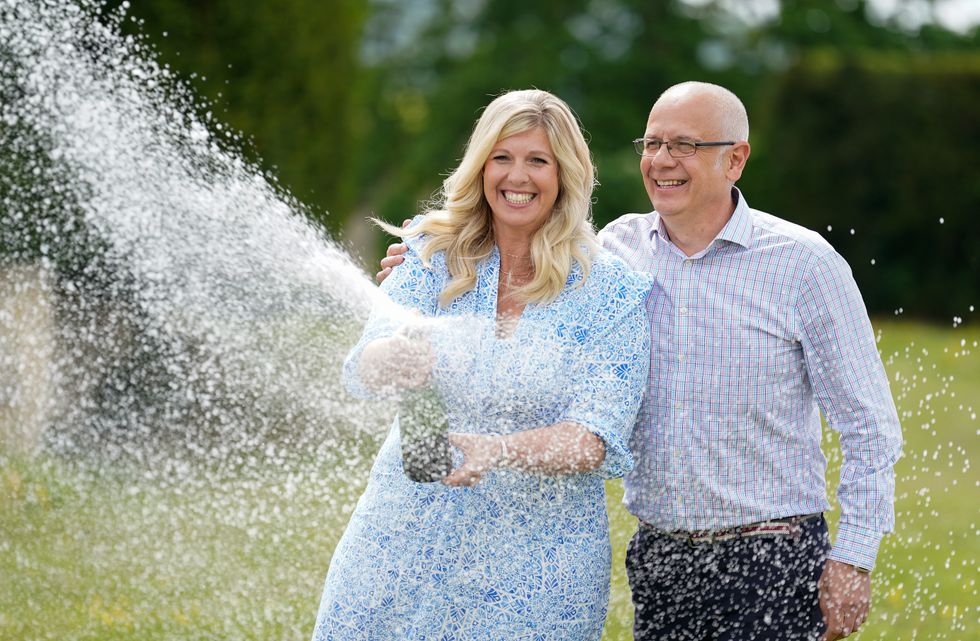Joe Thwaite, 49, and Jess Thwaite, 46, from Gloucestershire celebrate after winning the record-breaking EuroMillions jackpot of 184M from the draw on Tuesday 10 May, 2022, at the Ellenborough Park Hotel, in Cheltenham, Gloucestershire. Picture date: Thursday May 19, 2022.
