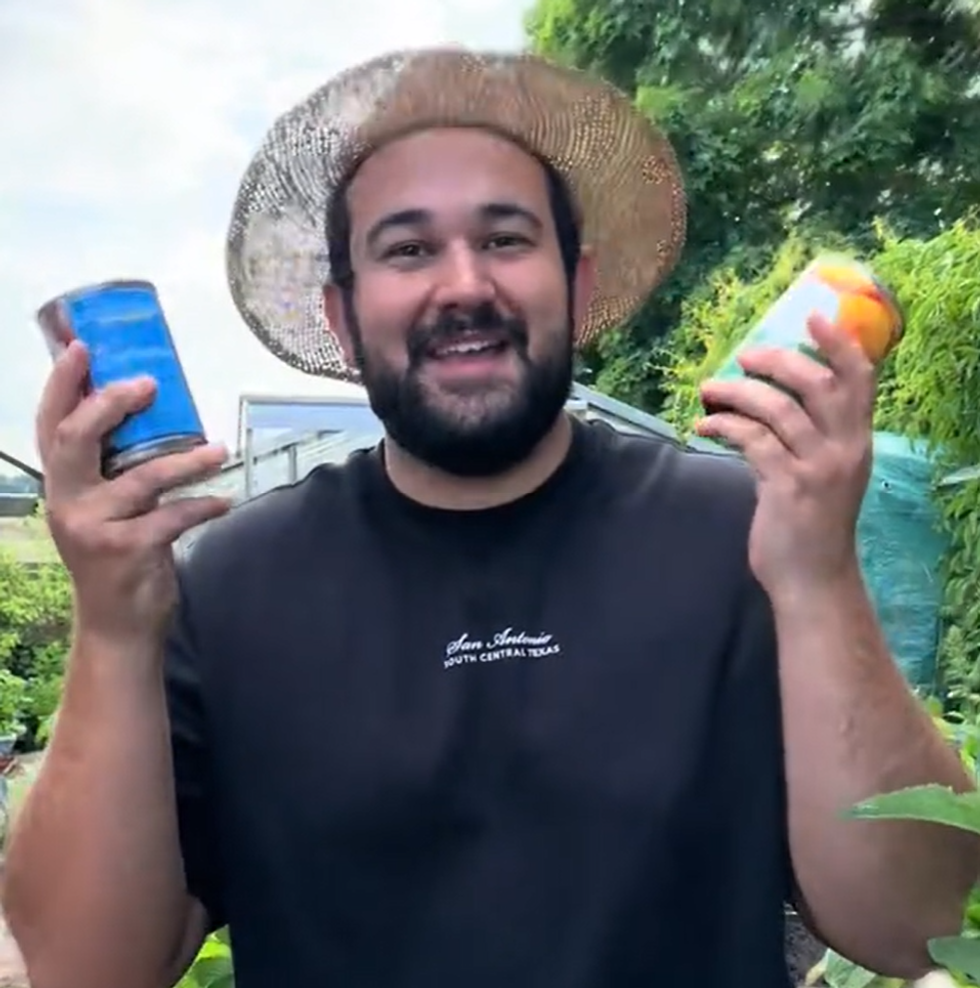 Joe wearing a hat holding two tins