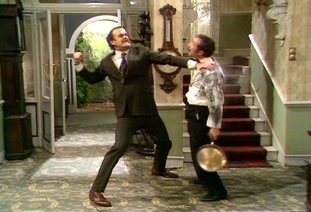 John Cleese as Basil Fawlty