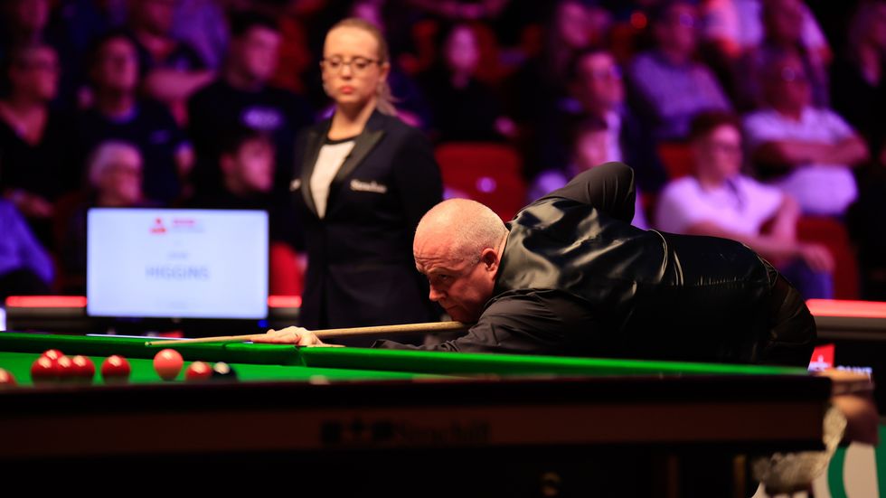 John Higgins' match was briefly suspended
