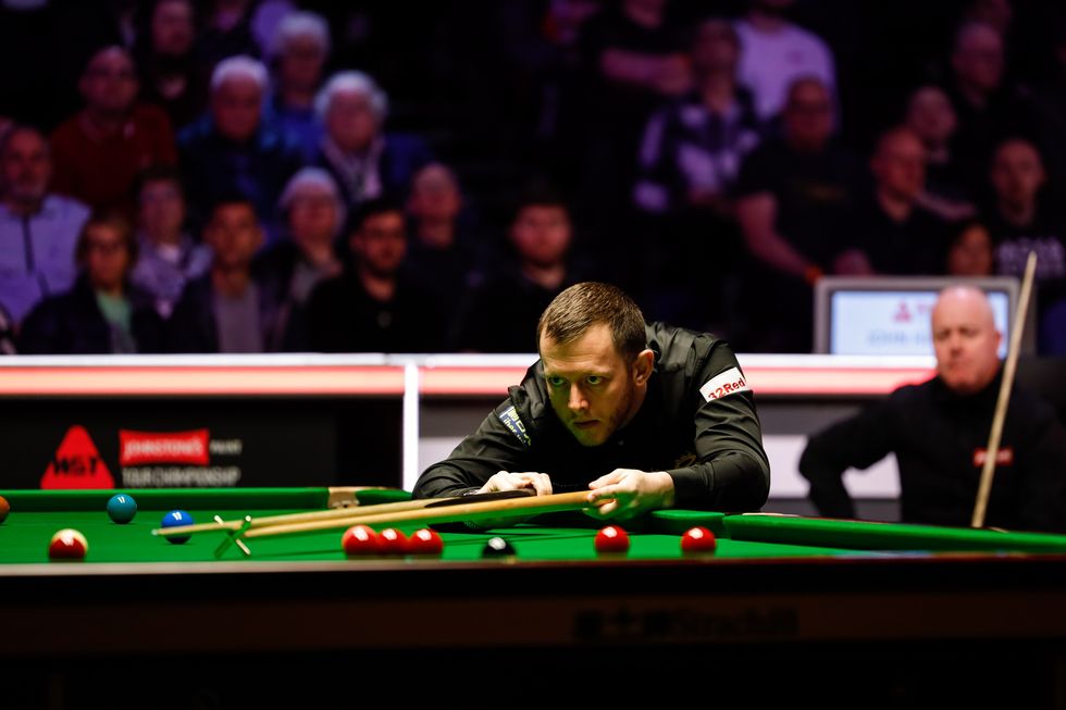 John Higgins was knocked out of the Tour Championship by Mark Allen
