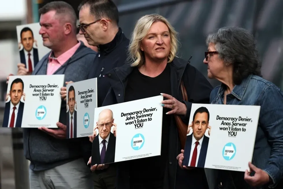 John Swinney's anti-Reform summit rocked by protesters as SNP accused of being 'scared' of Nigel Farage