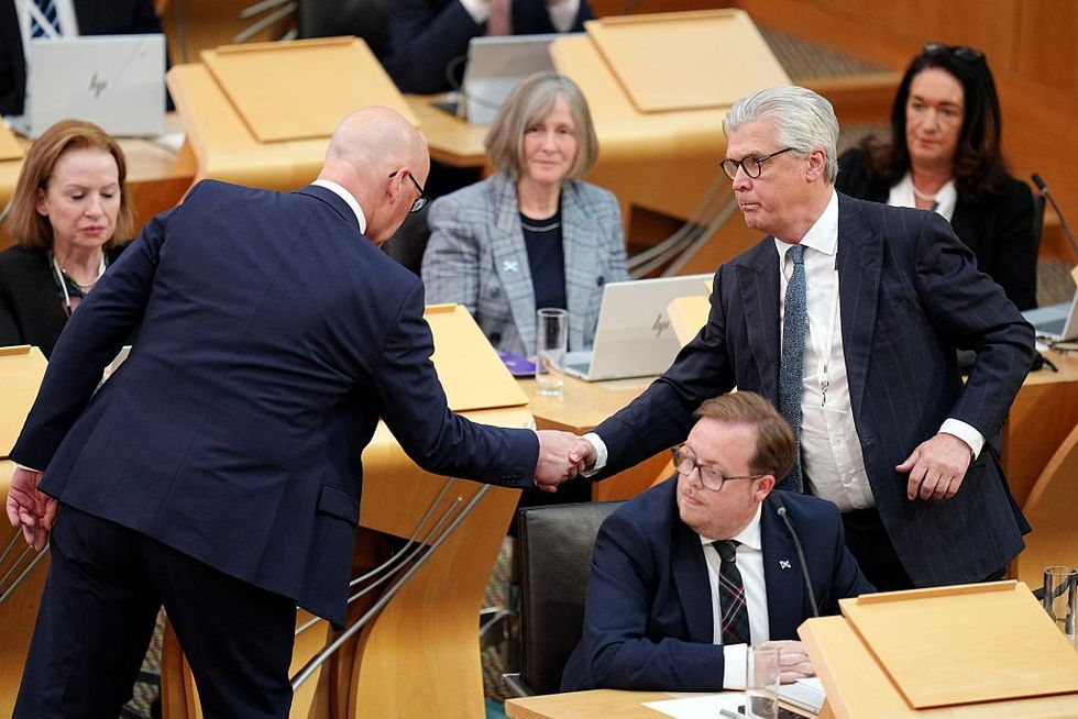 John Swinney shaking hands with Malcolm Offord
