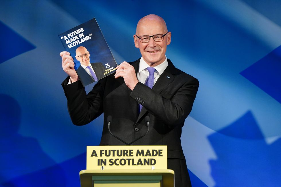 John Swinney unveiling the SNP manifesto