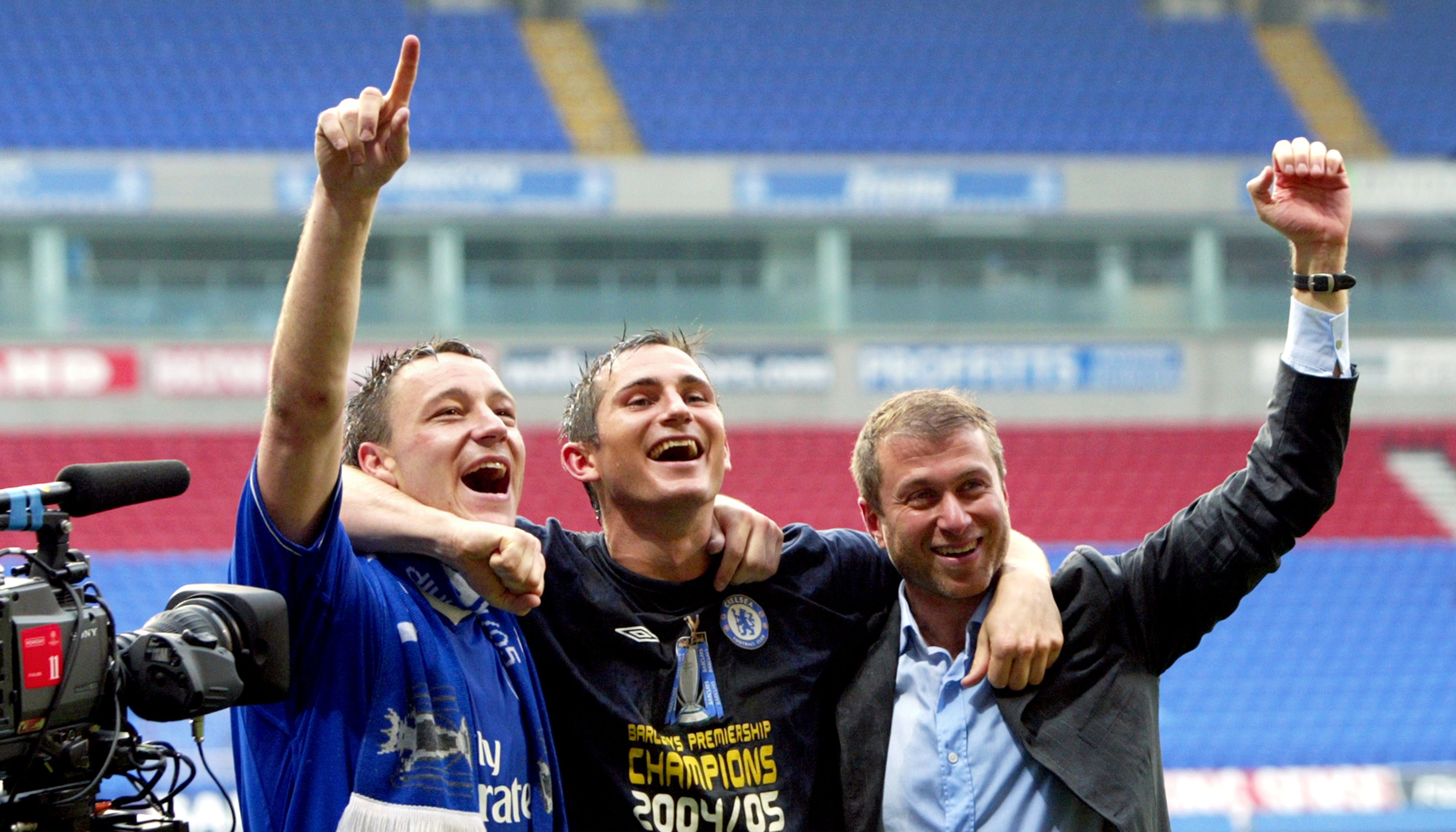 John Terry (L) celebrating with Chelsea owner Roman Abramovich