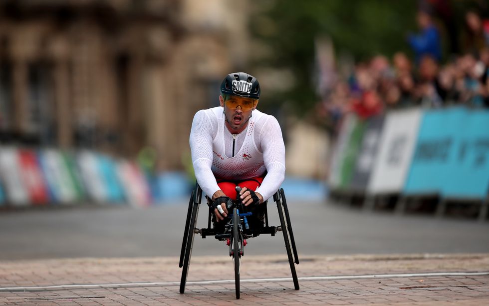 Johnboy Smith took advantage of David Weir's puncture to claim the gold medal.
