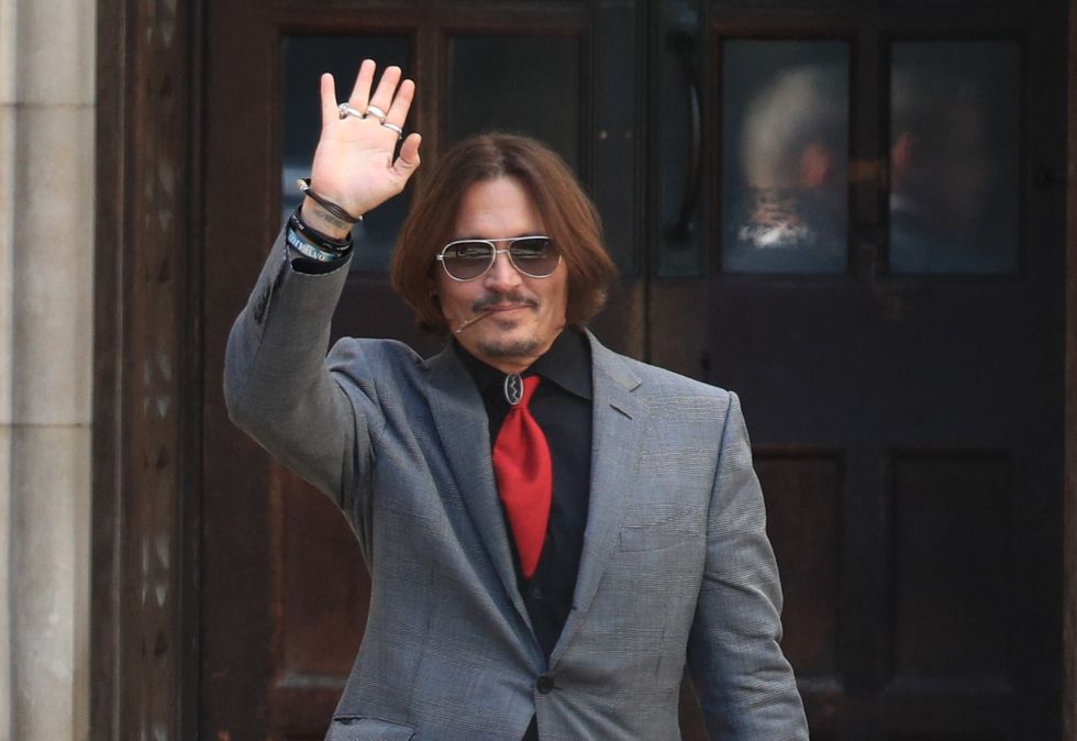 Johnny Depp waving