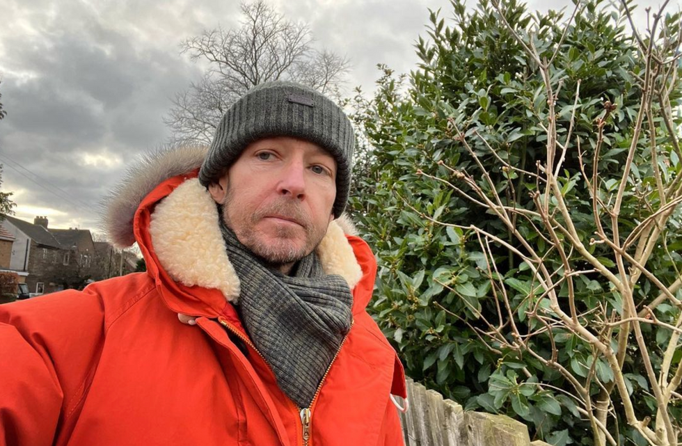 Jonnie Irwin wearing a hat and coat outside