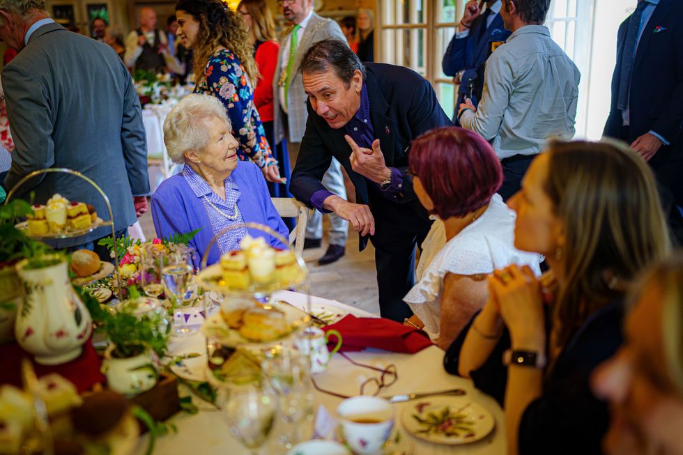 Jools Holland meets Elizabeth Powell, who celebrated her 100th birthday on May 6th 2022, during a Jubilee tea dance hosted by The Prince's Foundation to mark the Platinum Jubilee, at Highgrove near Tetbury, Gloucestershire. Prince Charles was joined by Jools Holland, Ruby Turner and Patrick Grant at the celebratory tea dance, one of many held across the UK by The Prince's Foundation, whose objective is to combat loneliness and isolation in surrounding communities. Picture date: Tuesday May 31, 2022.