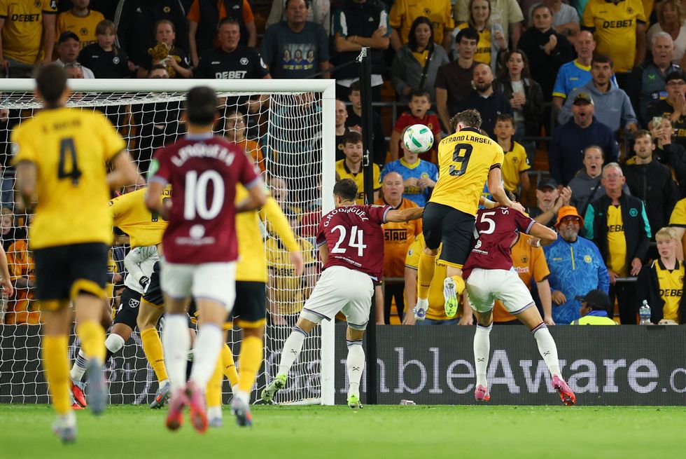 Jorgen Strand Larsen scored two late goals to send Wolves through to the next round of the Carabao Cup