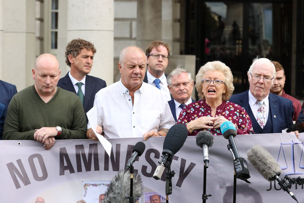 Julie Hambleton (centre right) speaking outside Belfast City Hall after a meeting of victims of The Troubles
