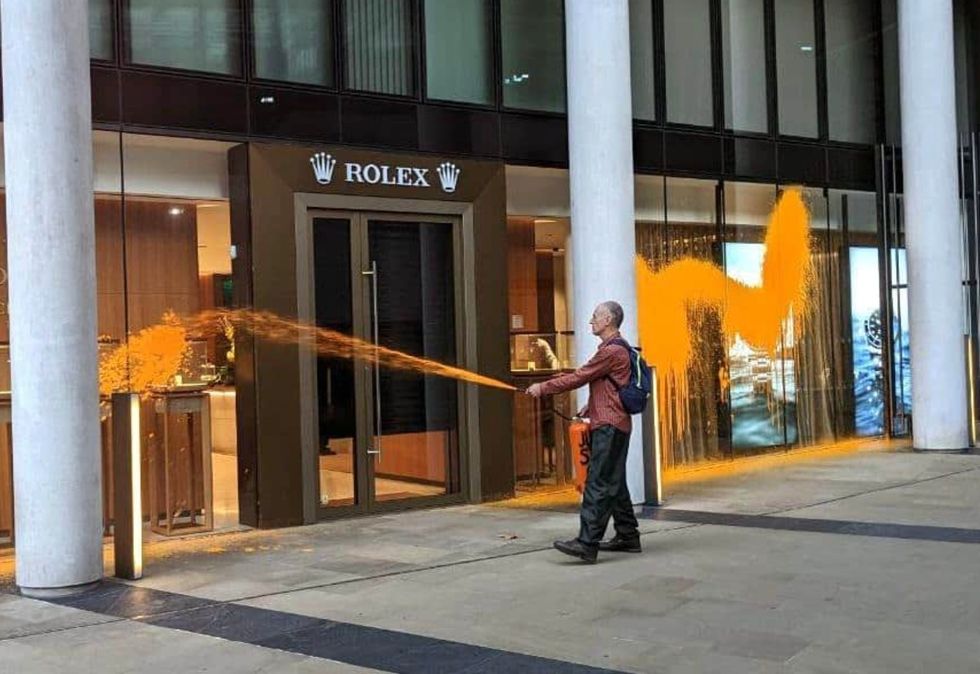 Just Stop Oil activists have sprayed a Rolex shop in London with orange paint