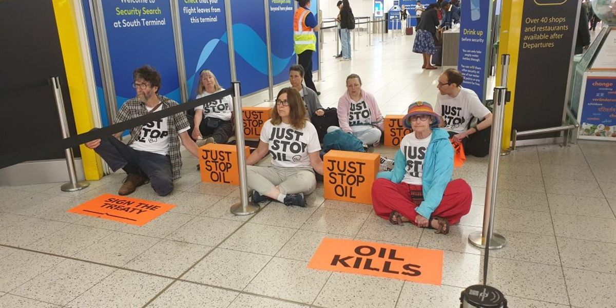 NextImg:Just Stop Oil activists spark major delays as they block departure gates at Gatwick Airport
