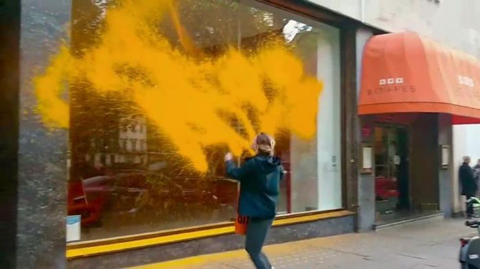 Just Stop Oil activists spray orange paint over high-end car dealerships in London