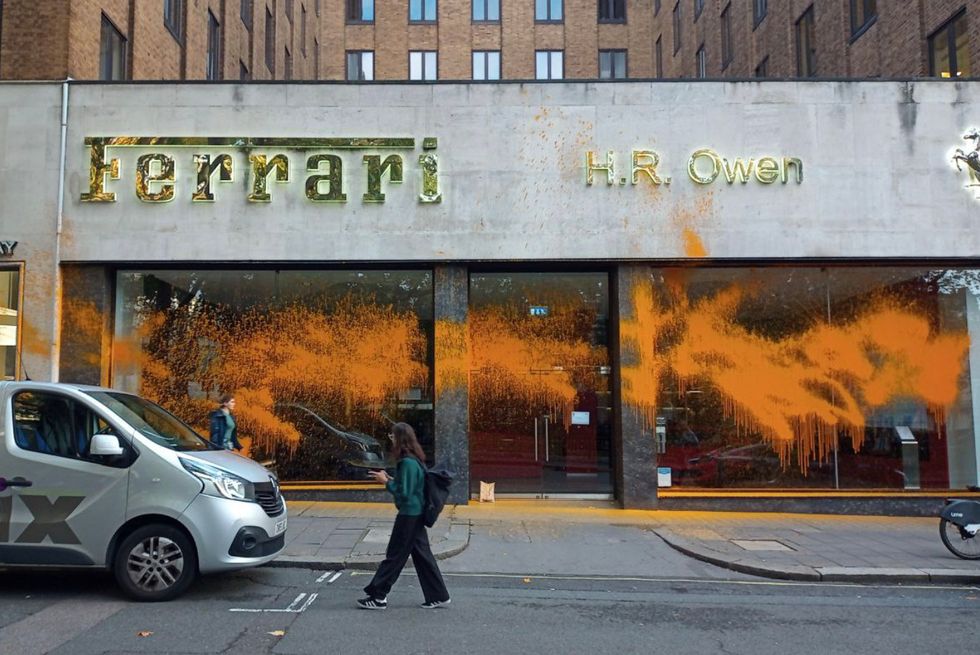 Just Stop Oil have sprayed high-end car dealerships with orange paint