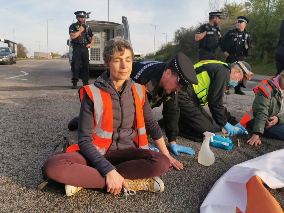 Just Stop Oil protester Louise Lancaster glues herself to the road