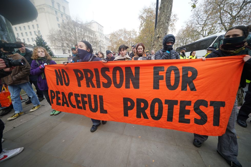 Just Stop Oil protesters demonstrate outside New Scotland Yard in London