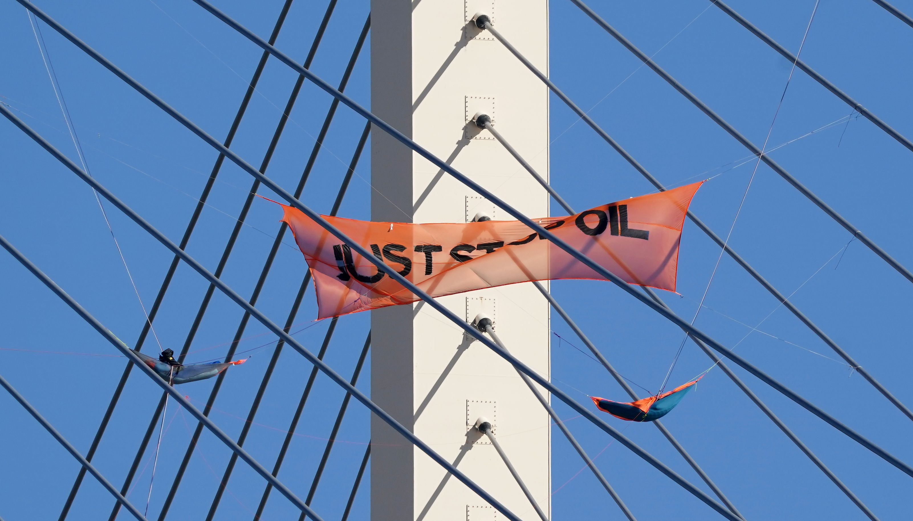 Just Stop Oil protesters on the Queen Elizabeth II Bridge, which links Kent and Essex.