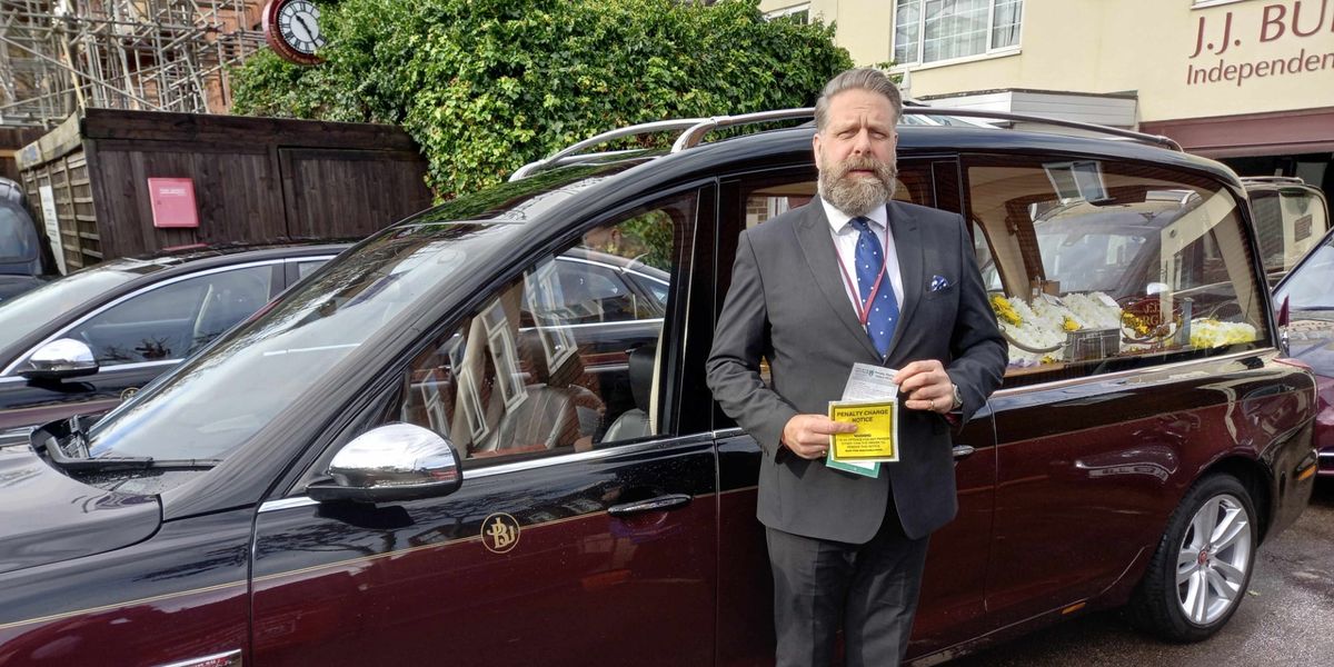 NextImg:Fury as ‘jobsworth’ traffic warden tries to ticket HEARSE during a funeral