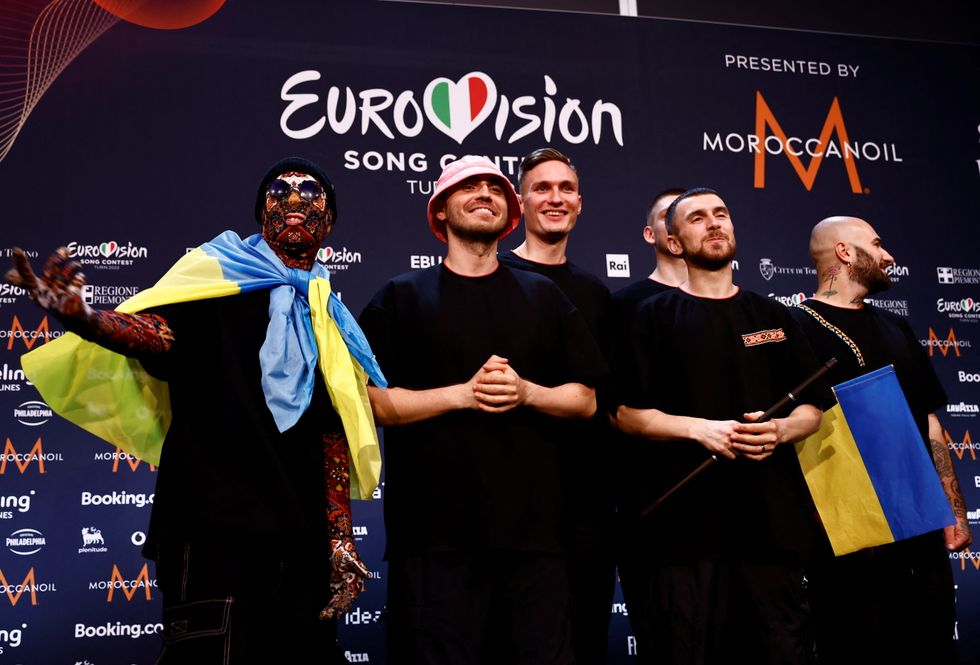 Kalush Orchestra from Ukraine pose for photographers after winning the 2022 Eurovision Song Contest