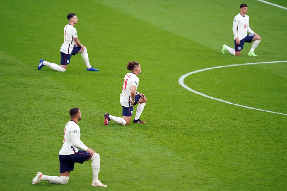 Kalvin Phillips and his team-mates take the knee during the UEFA Euro 2020 semi final match at Wembley Stadium.
