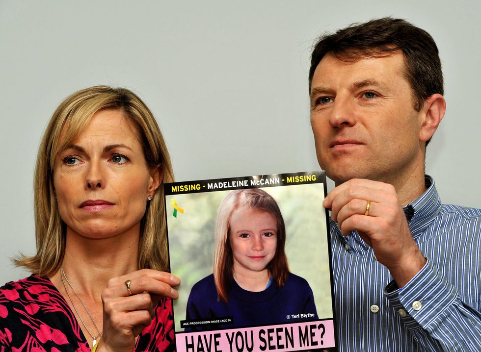 Kate and Gerry McCann hold poster of missing Madeleine