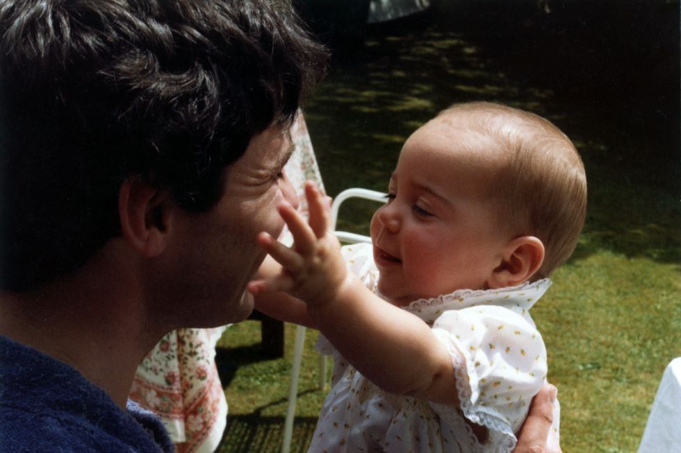 Kate can be seen reaching out to her father, Michael Middleton.