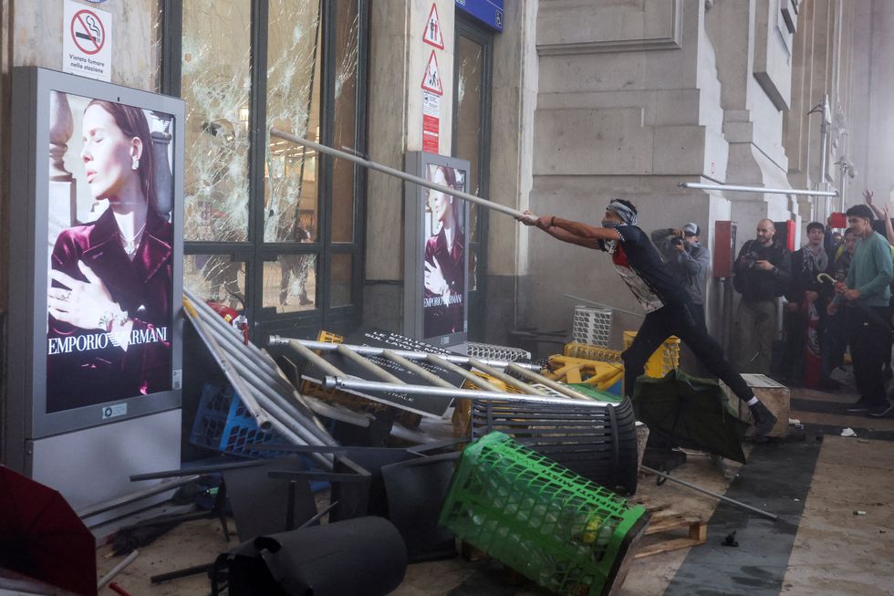 Keffiyeh-clad thugs smash windows and pile furniture inside the station