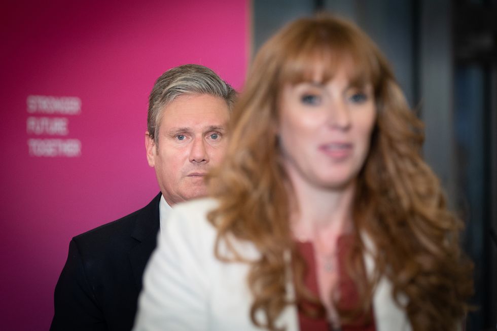 Keir Starmer behind Angela Rayner
