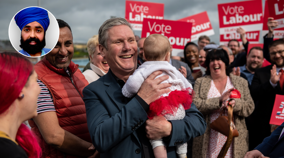 Keir Starmer holding a baby