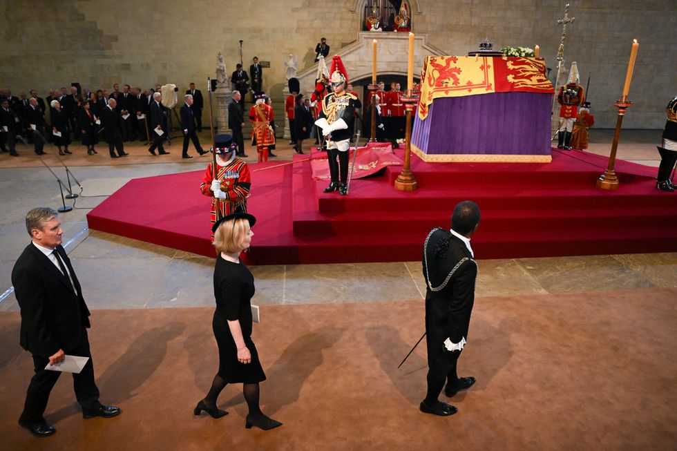 Keir Starmer, Leader of the Labour Party and Prime Minister Liz Truss file past Queen Elizabeth II's coffin in Westminster Hall for the Lying-in State on September 14, 2022 in London, England. David Ramos/Pool via REUTERS