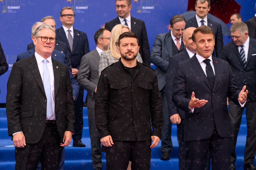 Keir Starmer, Ukraine's President Volodymyr Zelenskyy and France's President Emmanuel Macron stand together during the family photo at the 6th European Political Community