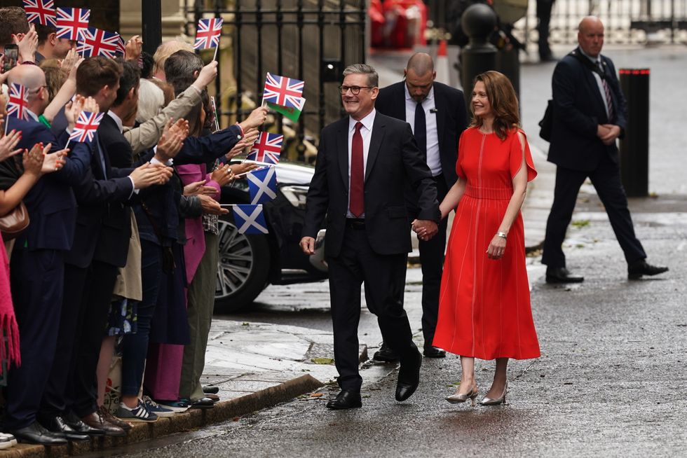 Keir Starmer walked to Downing Street as fans wave flags