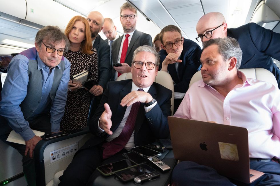 Keir Starmer with journalists on board the plane to Washington DC