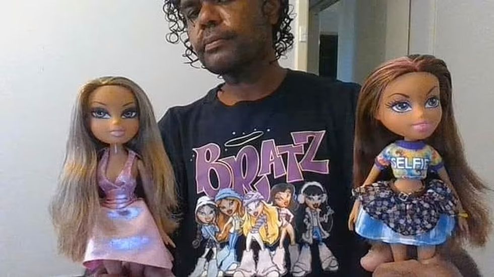 Kelly was pictured with a pair of the dolls