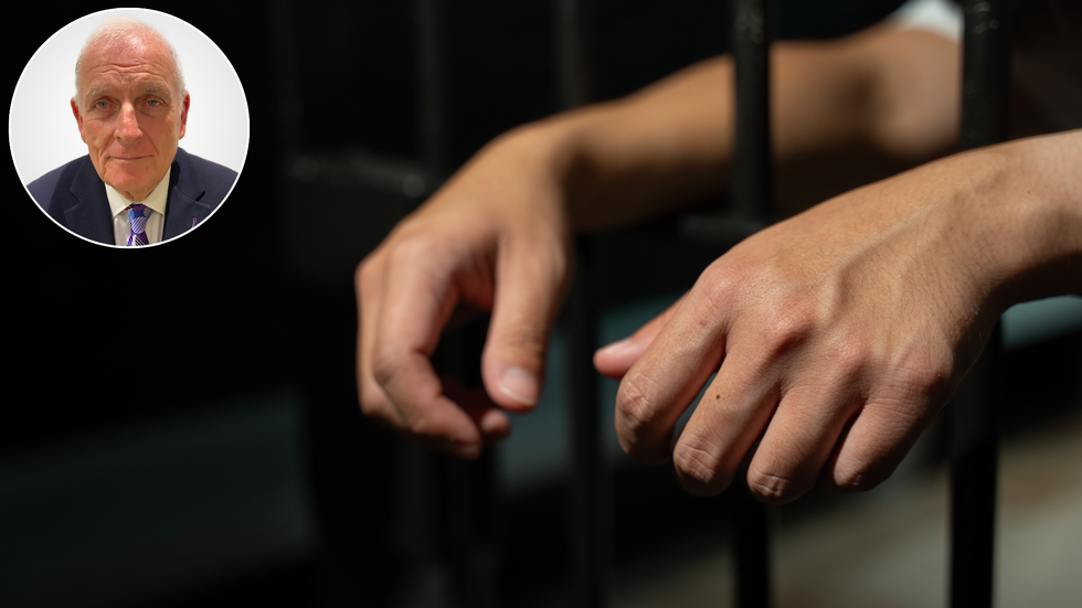 Kelvin MacKenzie and a prisoner in jail