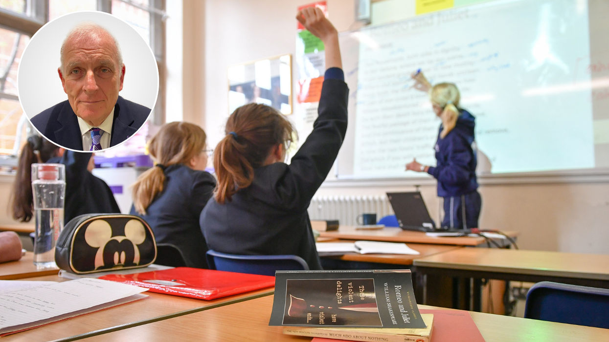Kelvin Mackenzie and a teacher and students in a classroom