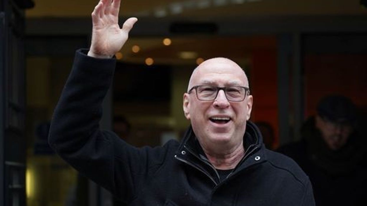 Ken Bruce waving as he leaves the BBC