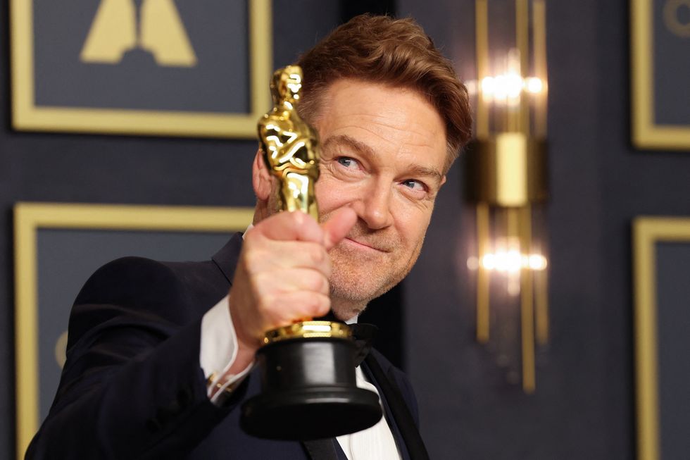Kenneth Branagh poses with the Oscar for Best Original Screenplay for %22Belfast%22 in the photo room during the 94th Academy Awards in Hollywood, Los Angeles, California, U.S.
