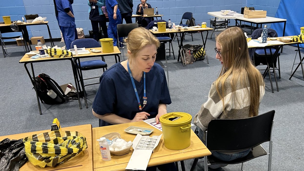 Kent student getting a meningitis vaccination