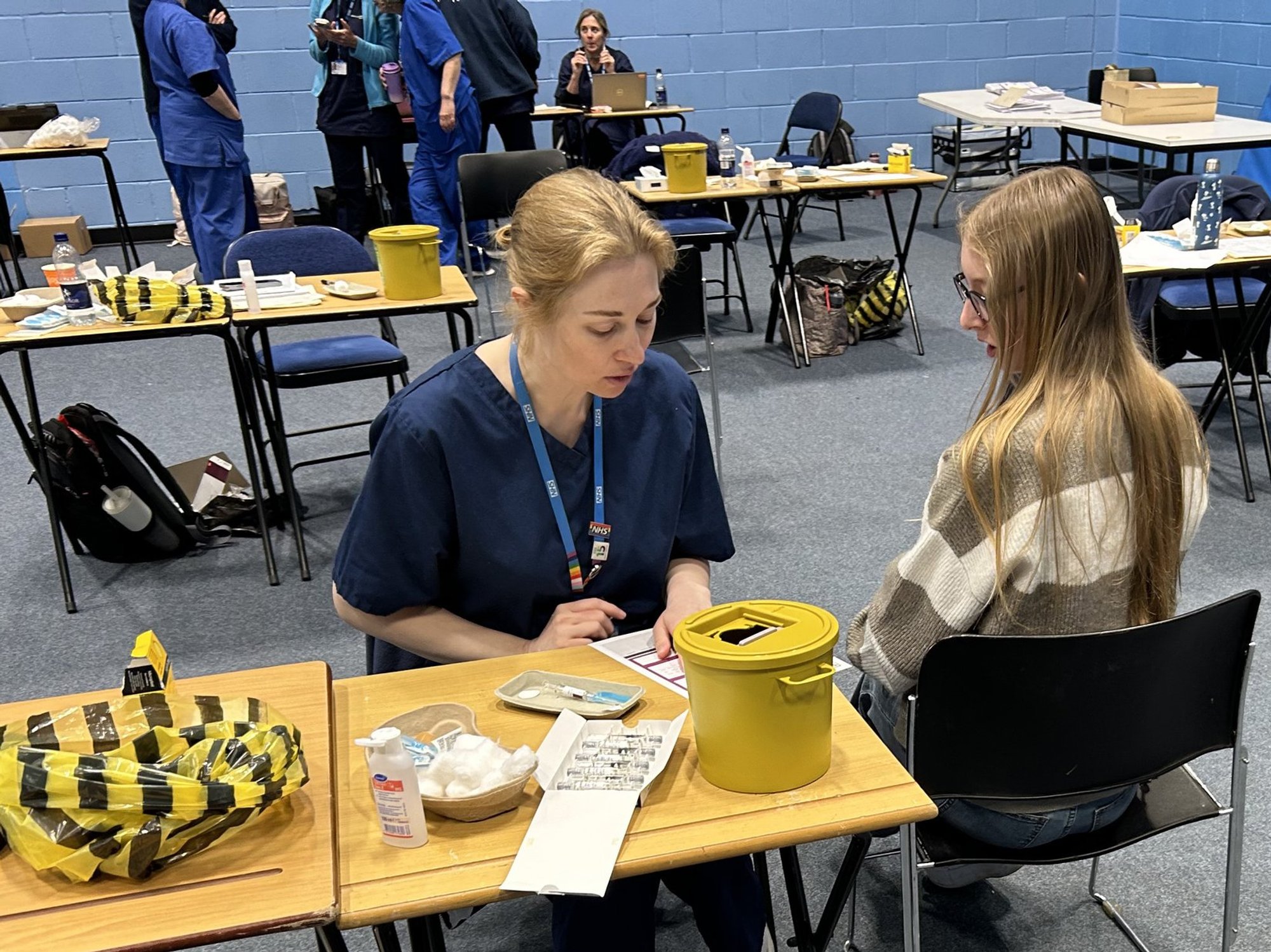 Kent student getting a meningitis vaccination