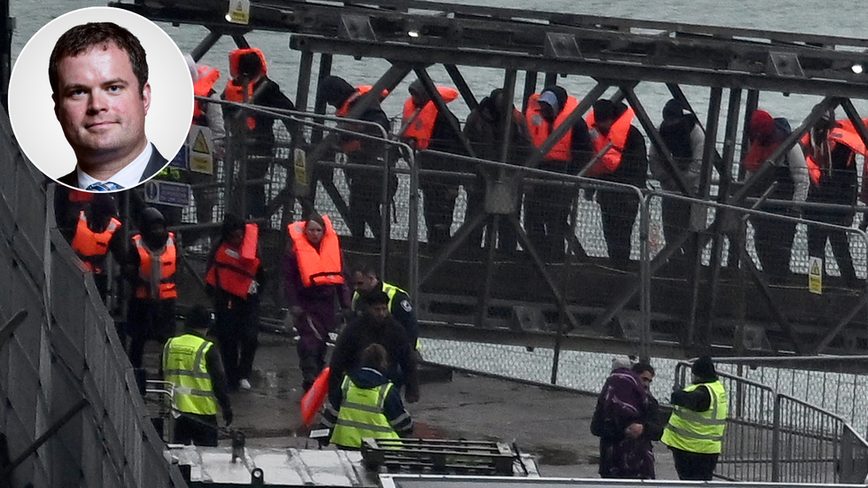 Kevin Foster and migrants arriving in Dover