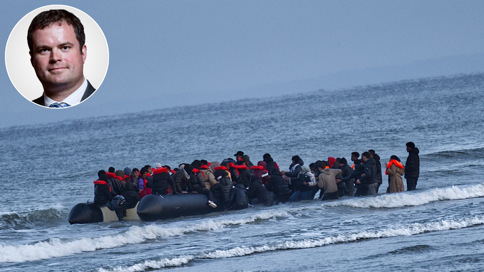 Kevin Foster and migrants crossing the channel in a small boat